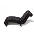 Upholstered leather upholstered lounge chair with brown buttons