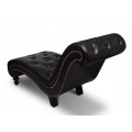 Upholstered leather upholstered lounge chair with brown buttons